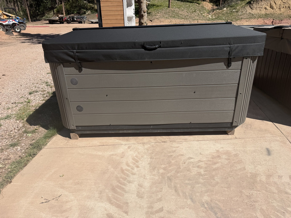 Refurbished Cal Spa 893B hot tub, gray cabinet with cover closed