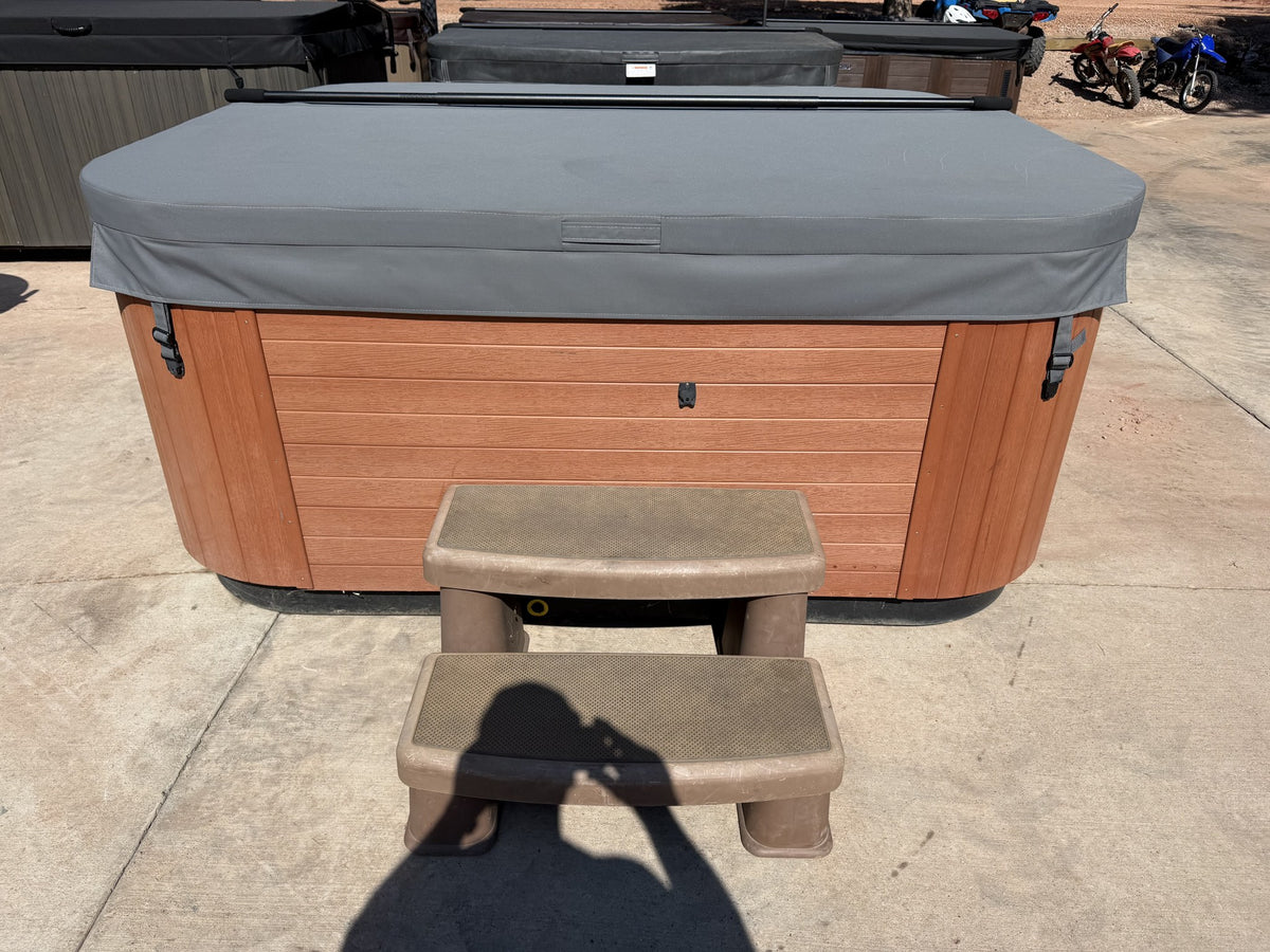 Refurbished Bull Frog Spa with premium cover and steps