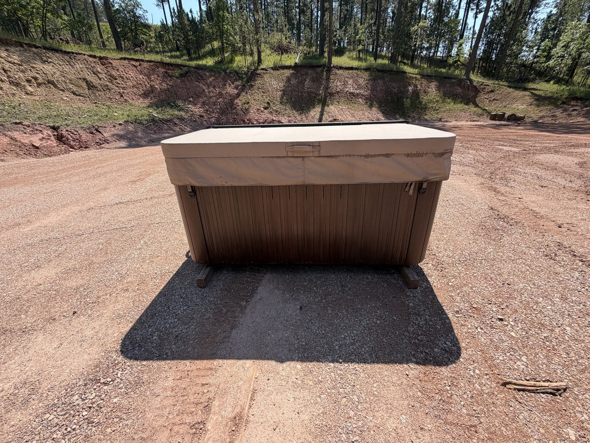 Jacuzzi J-245 hot tub closed with premium cover, brown cabinet, front view