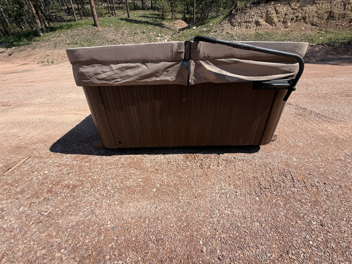 Side view of the Jacuzzi J-245 with cover lifter installed