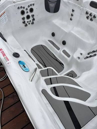 H2X Therapool Deep interior showing the open therapy floor, contoured seats and stainless steel jets